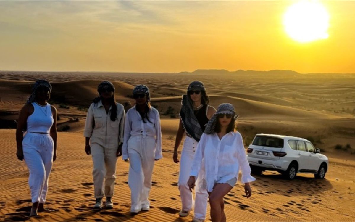 Desert safari sunset over golden sand dunes